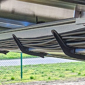 Cable holder for cable routing along long and main beams